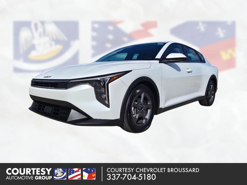 2025 Kia K4 LXS in White — front three-quarter view
